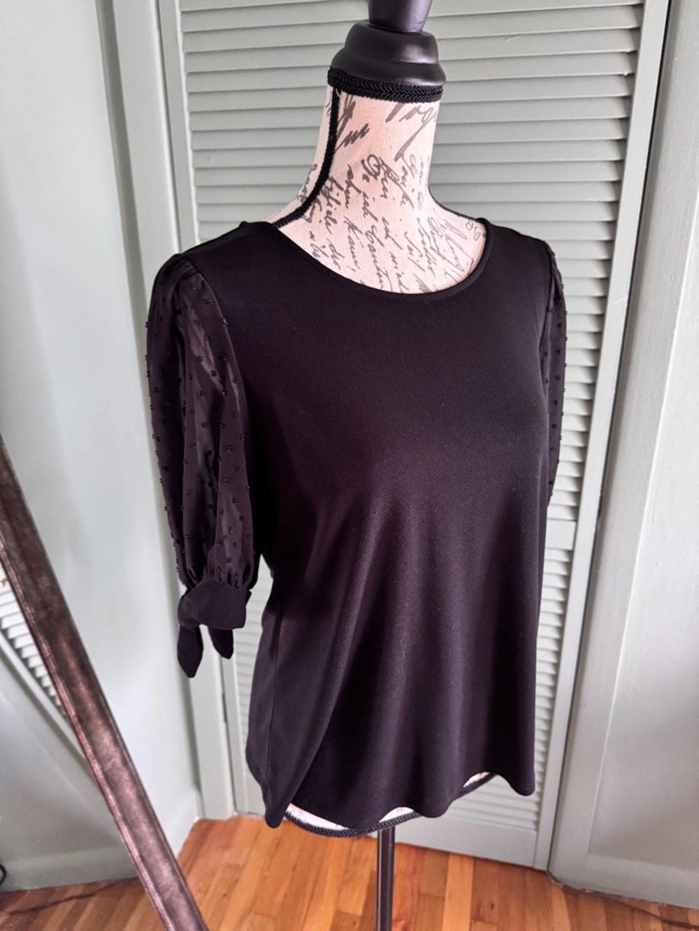 CeCe Black Puff-Sleeve Knit Top with Sheer Dot Sleeves